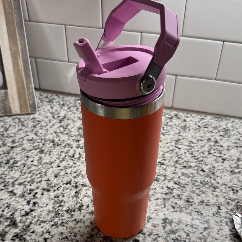 Stanley Orange Tumbler with Pink Lid